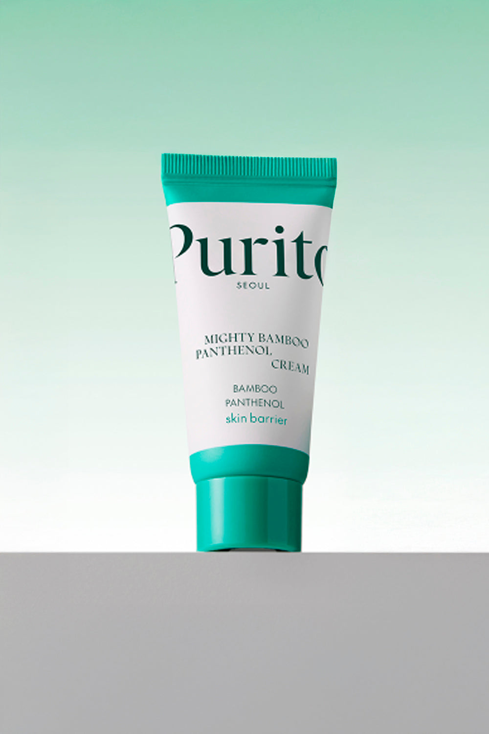 Miniatura da bisnaga Purito Mighty Bamboo Panthenol Cream, sobre fundo verde claro